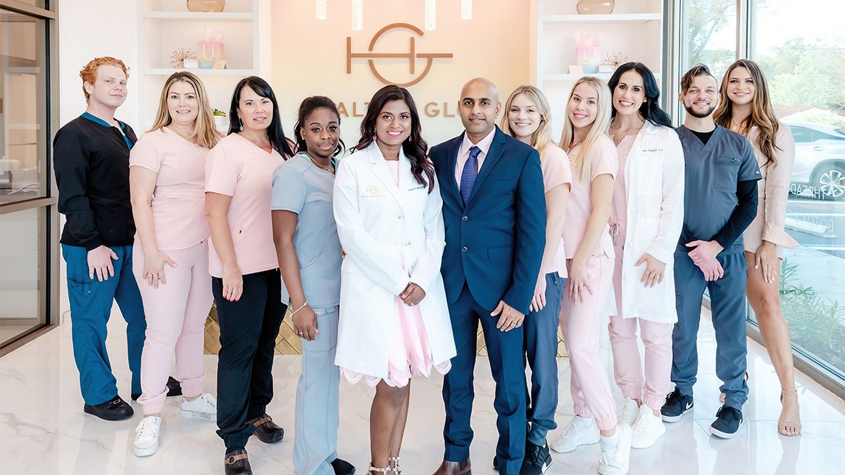 "Diverse professionals collaborating in a vibrant workplace, representing rewarding careers, medical spa jobs, and primary care jobs at Health + Glow Medspa.