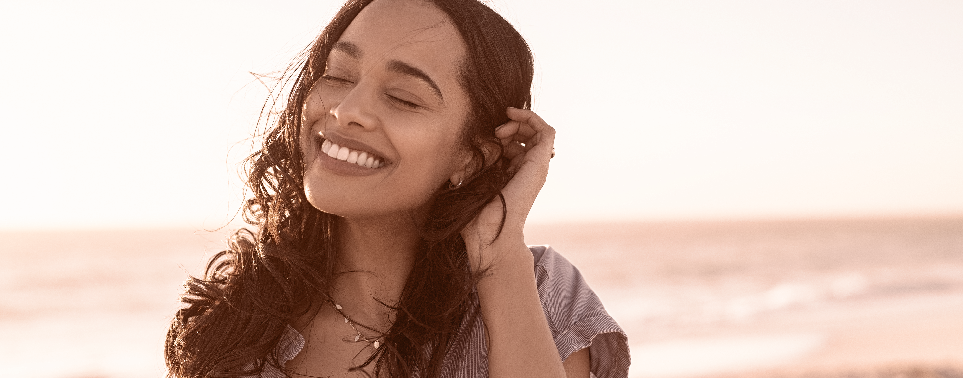 Woman smiling after non-surgical eye lift procedure done at Health and Glow.