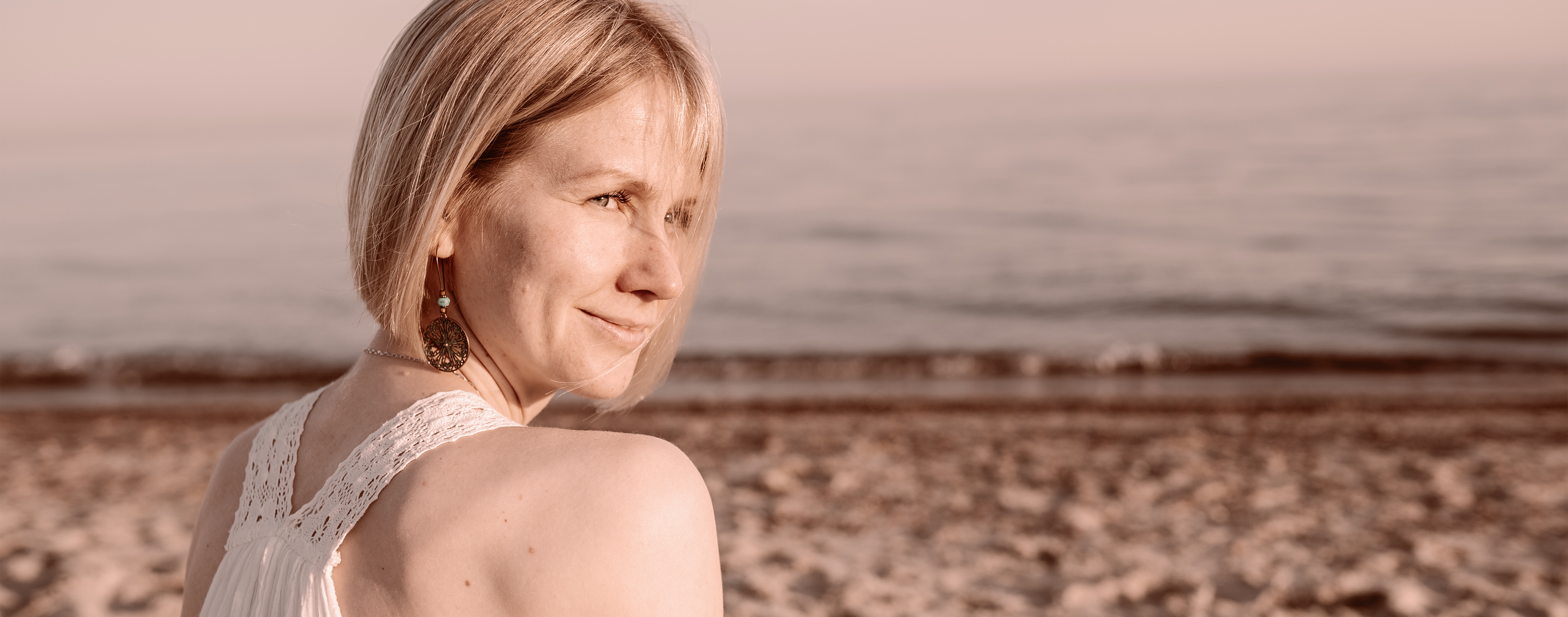 Woman smiling after broad band light treatment to reduce spots.